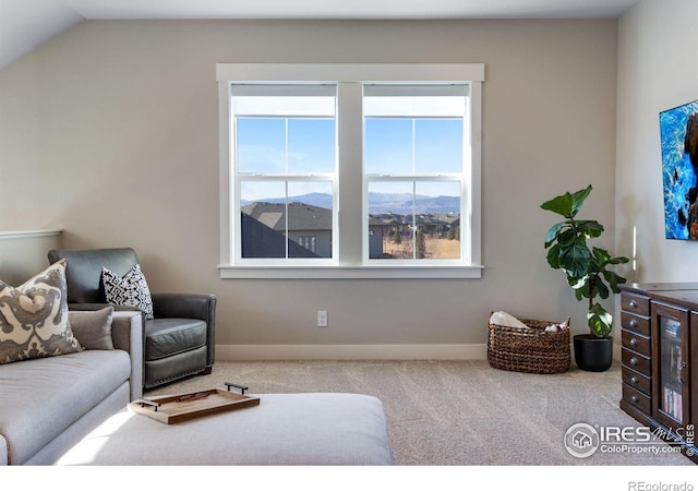 4268 Ardglass Ln, Timnath, CO 80547 - living area with carpet flooring, plenty of natural light, baseboards, and vaulted ceiling
