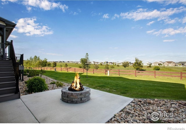 4268 Ardglass Ln, Timnath, CO 80547 - view of patio with an outdoor fire pit and stairs