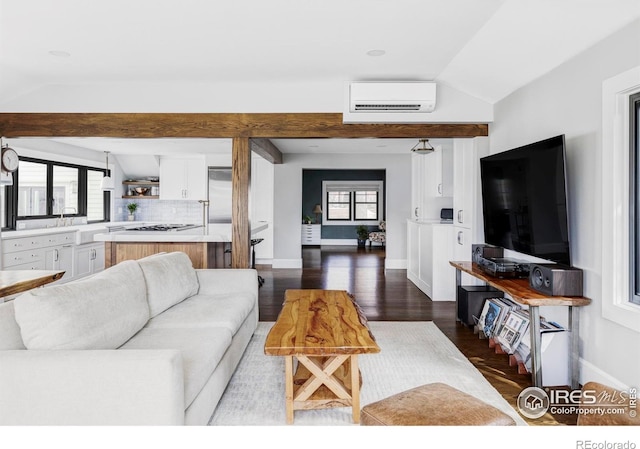 920 Hawthorn Ave, Boulder, CO 80304 - living area with lofted ceiling, a wall mounted AC, healthy amount of natural light, baseboards, and dark wood-style flooring