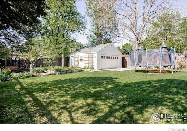 920 Hawthorn Ave, Boulder, CO 80304 - view of yard featuring a trampoline, a detached garage, and an outbuilding