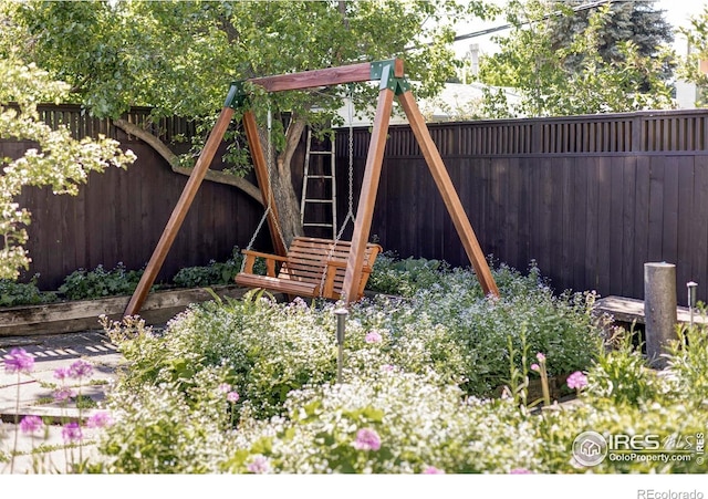 920 Hawthorn Ave, Boulder, CO 80304 - fenced backyard featuring a playground
