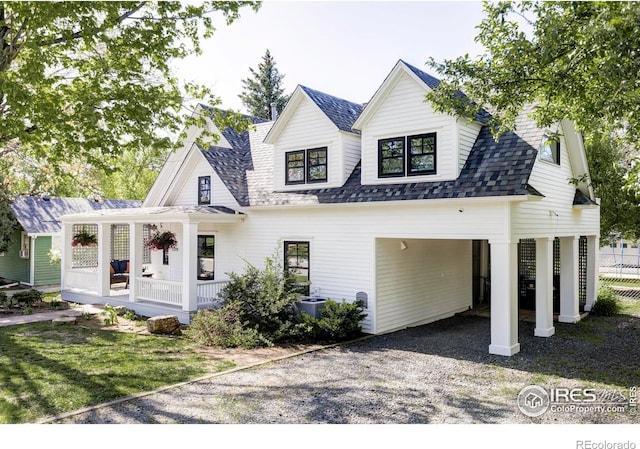 920 Hawthorn Ave, Boulder, CO 80304 - modern inspired farmhouse with covered porch, gravel driveway, and roof with shingles