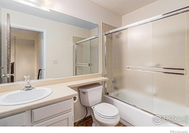 4116 W 111th Cir, Westminster, CO 80031 - bathroom with vanity, shower / bath combination with glass door, and toilet