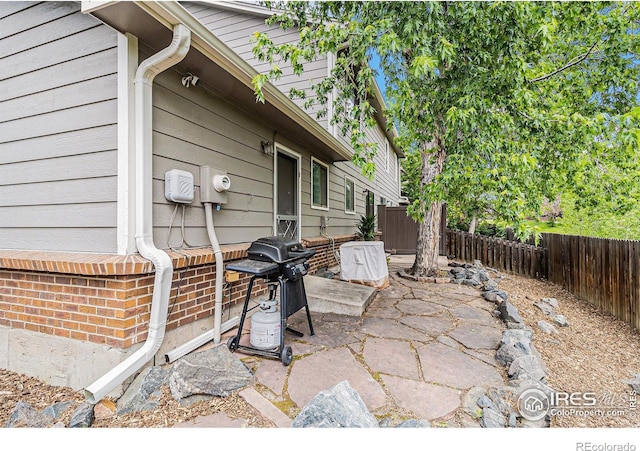 4116 W 111th Cir, Westminster, CO 80031 - fenced backyard featuring grilling area and a patio
