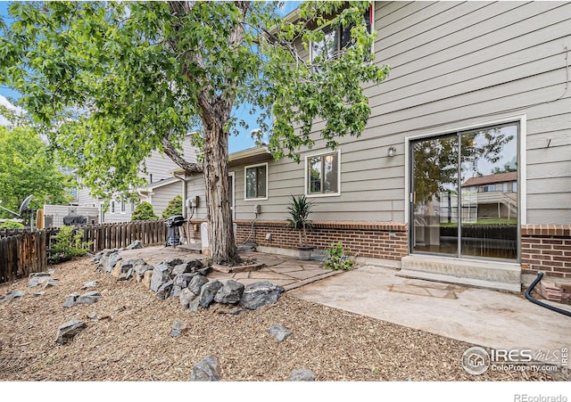 4116 W 111th Cir, Westminster, CO 80031 - back of property featuring brick siding and a patio area