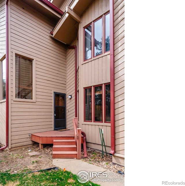 4570 Macarthur Dr, Boulder, CO 80303 - doorway to property featuring a wooden deck and board and batten siding