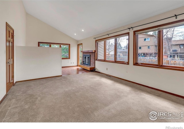 4570 Macarthur Dr, Boulder, CO 80303 - unfurnished living room featuring carpet flooring, plenty of natural light, baseboards, high vaulted ceiling, and recessed lighting