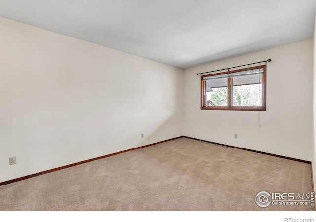 4570 Macarthur Dr, Boulder, CO 80303 - carpeted spare room with baseboards