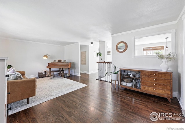 8290 Chase Way, Arvada, CO 80003 - living room with wood finished floors, crown molding, and baseboards