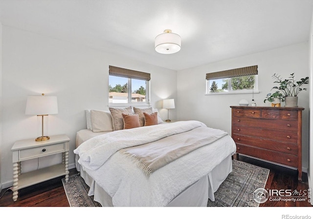 8290 Chase Way, Arvada, CO 80003 - bedroom with dark wood-style floors