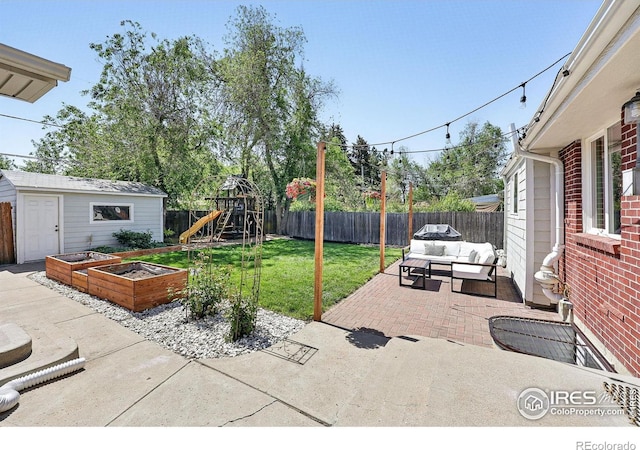 8290 Chase Way, Arvada, CO 80003 - view of patio with an outdoor hangout area, a garden, and a playground