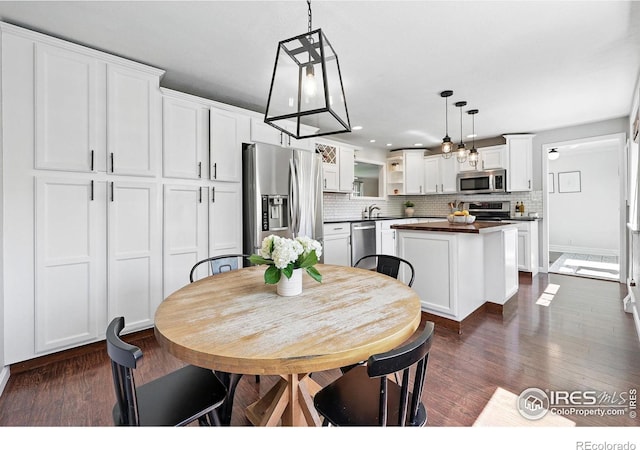 8290 Chase Way, Arvada, CO 80003 - dining area with dark wood-style floors and recessed lighting