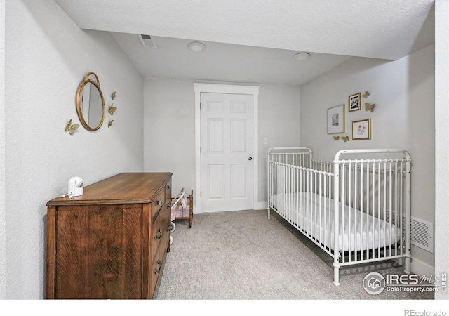 8290 Chase Way, Arvada, CO 80003 - bedroom featuring carpet floors and a nursery area