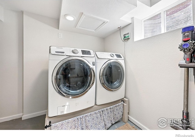 8290 Chase Way, Arvada, CO 80003 - laundry area with baseboards, washing machine and clothes dryer, and attic access