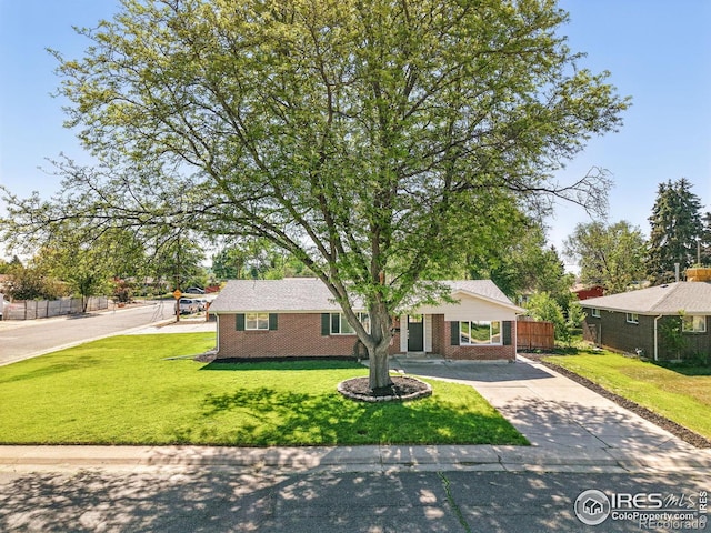 8290 Chase Way, Arvada, CO 80003 - ranch-style house featuring driveway and brick siding