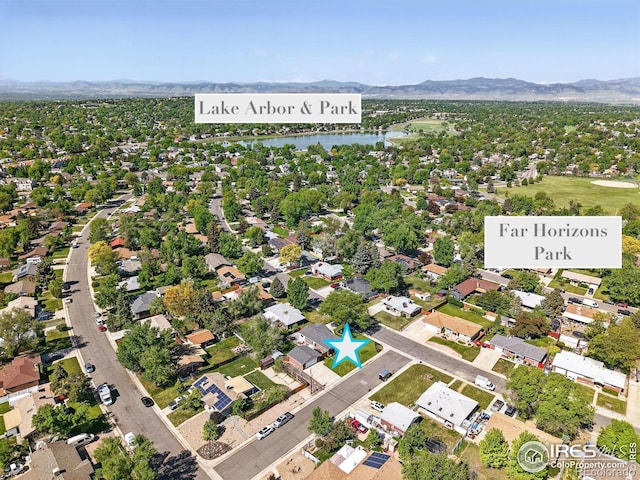 8290 Chase Way, Arvada, CO 80003 - aerial overview of property's location with a water and mountain view and nearby suburban area
