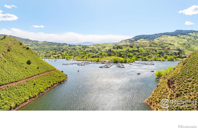 4402 Kano Dr, Fort Collins, CO 80526 - water view with a mountain backdrop