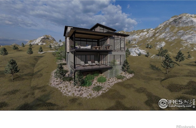 4402 Kano Dr, Fort Collins, CO 80526 - rear view of house with a balcony and a mountain view