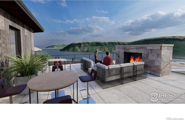 4402 Kano Dr, Fort Collins, CO 80526 - view of patio / terrace with an outdoor living space with a fireplace and a water view