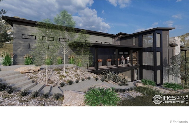 4402 Kano Dr, Fort Collins, CO 80526 - back of house featuring a balcony and a sunroom