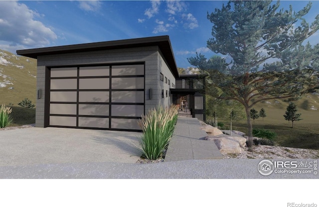 4402 Kano Dr, Fort Collins, CO 80526 - view of front of property featuring a garage and driveway