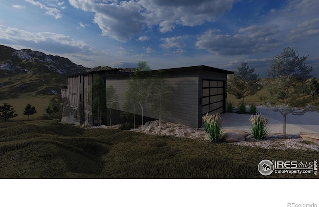 4402 Kano Dr, Fort Collins, CO 80526 - view of side of property featuring a garage, driveway, and a mountain view