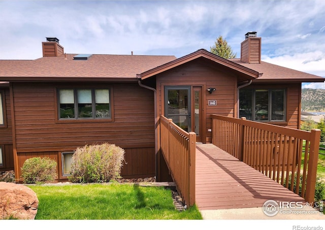 1443 Matthew Cir, Estes Park, CO 80517 - view of front of house featuring a chimney and a shingled roof