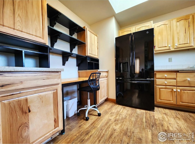 1443 Matthew Cir, Estes Park, CO 80517 - office area featuring light wood-style floors, built in desk, and a skylight