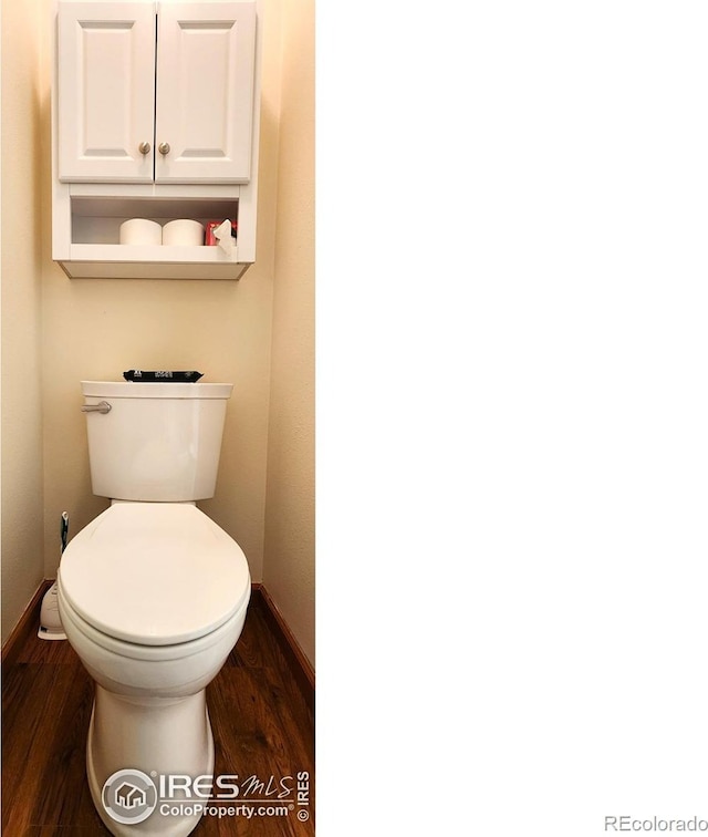 1443 Matthew Cir, Estes Park, CO 80517 - bathroom featuring baseboards, wood finished floors, and toilet
