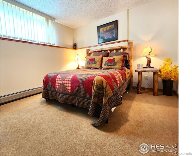 1443 Matthew Cir, Estes Park, CO 80517 - carpeted bedroom featuring a baseboard radiator and a textured ceiling