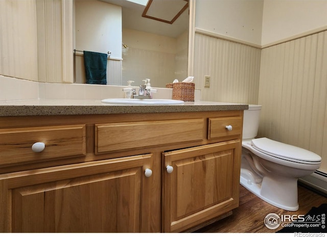 1443 Matthew Cir, Estes Park, CO 80517 - bathroom with wood finished floors, toilet, and vanity