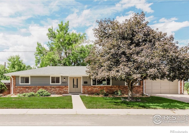 4601 S Lipan St, Englewood, CO 80110 - ranch-style house with brick siding, a front yard, driveway, and a garage