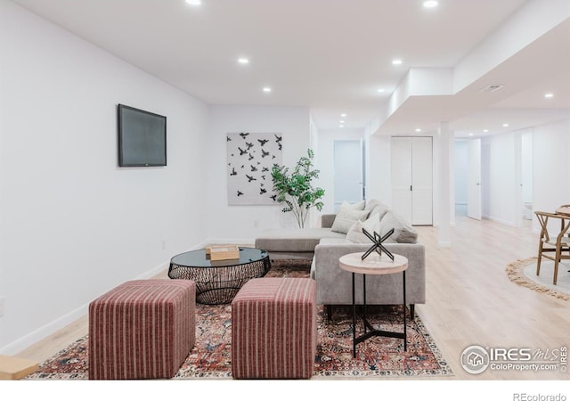 4601 S Lipan St, Englewood, CO 80110 - living room with light wood-style flooring, recessed lighting, and baseboards