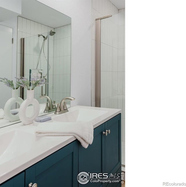 4601 S Lipan St, Englewood, CO 80110 - bathroom featuring double vanity and a tile shower