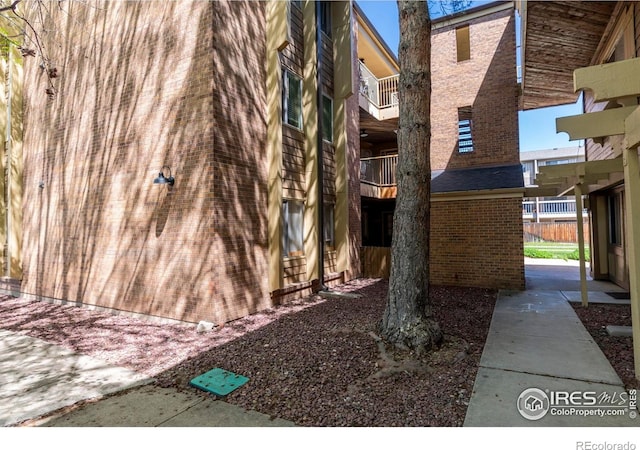 3313 Madison Ave Unit 212, Boulder, CO 80303 - view of side of property with a balcony and brick siding