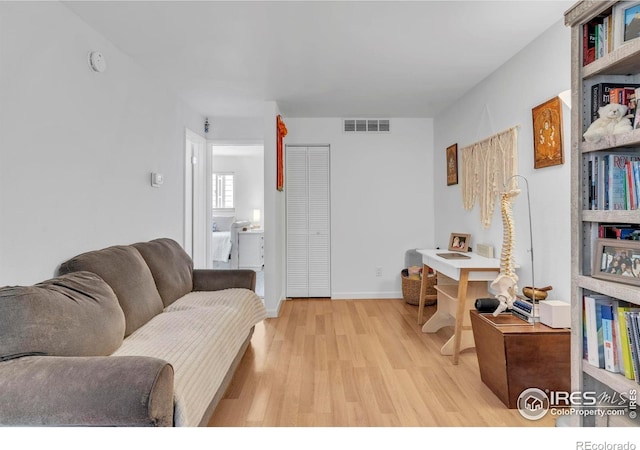3313 Madison Ave Unit 212, Boulder, CO 80303 - living room featuring light wood-type flooring and baseboards