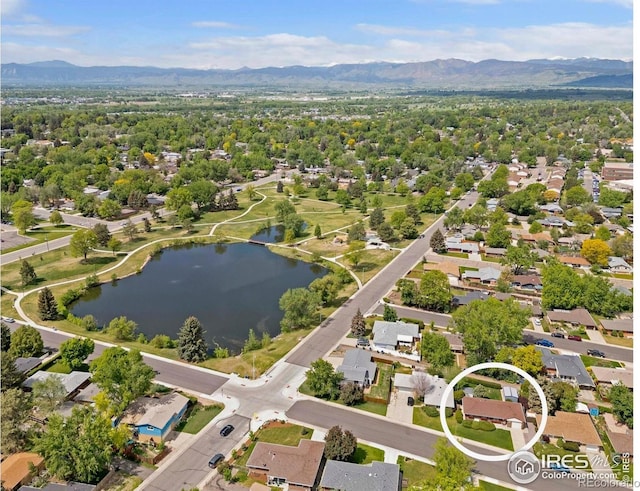 1229 Juniper St, Longmont, CO 80501 - aerial perspective of suburban area with a water and mountain view