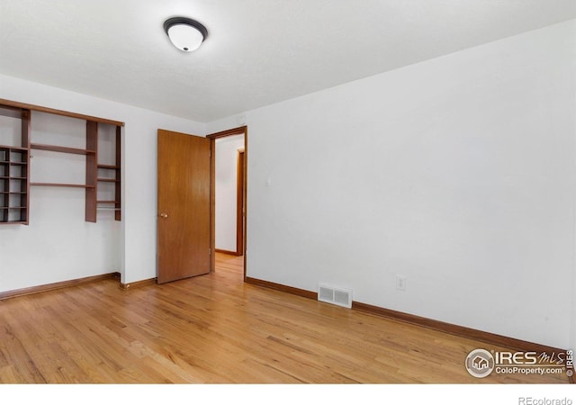1229 Juniper St, Longmont, CO 80501 - unfurnished bedroom featuring light wood-style flooring, baseboards, and a closet