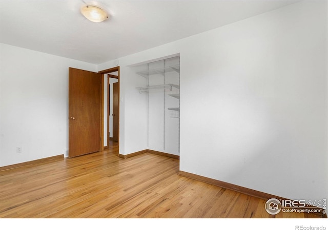 1229 Juniper St, Longmont, CO 80501 - unfurnished bedroom featuring light wood-style floors, baseboards, and a closet