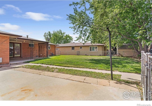 1229 Juniper St, Longmont, CO 80501 - view of yard with a patio