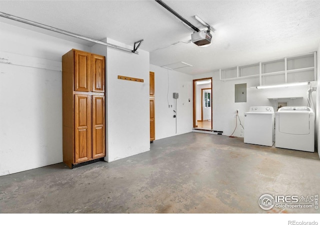 1229 Juniper St, Longmont, CO 80501 - garage featuring washer and clothes dryer, electric panel, and a garage door opener