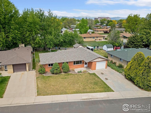 1229 Juniper St, Longmont, CO 80501 - aerial view of residential area with mountains