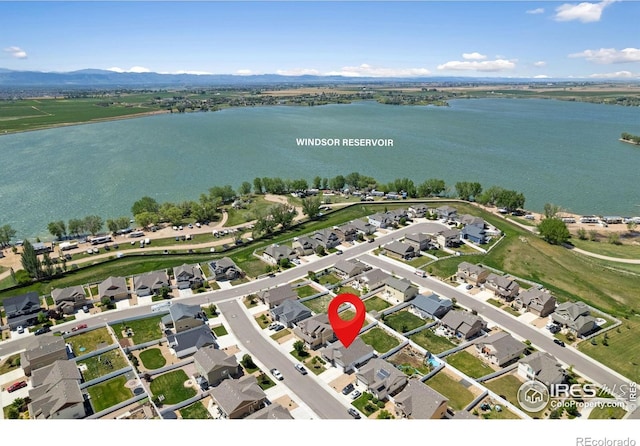 1566 Driftline Dr, Severance, CO 80550 - aerial perspective of suburban area with a water and mountain view