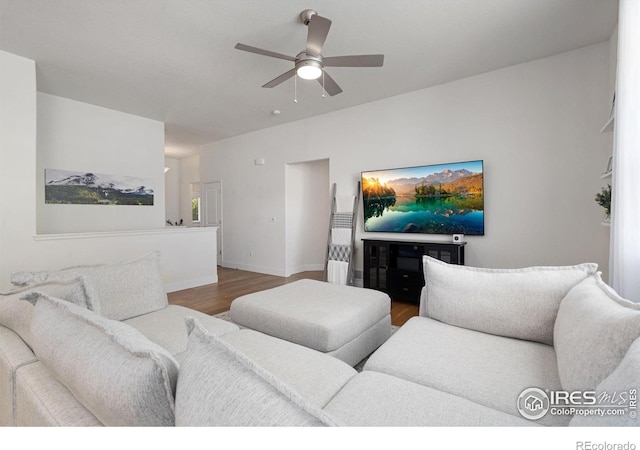 1566 Driftline Dr, Severance, CO 80550 - living room featuring wood finished floors, a ceiling fan, and baseboards