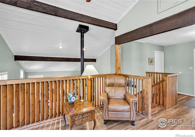 453 Black Fawn Ln, Westcliffe, CO 81252 - sitting room with wood finished floors, an upstairs landing, and baseboards
