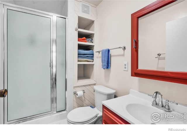 453 Black Fawn Ln, Westcliffe, CO 81252 - full bathroom featuring vanity, a shower stall, toilet, and built in features