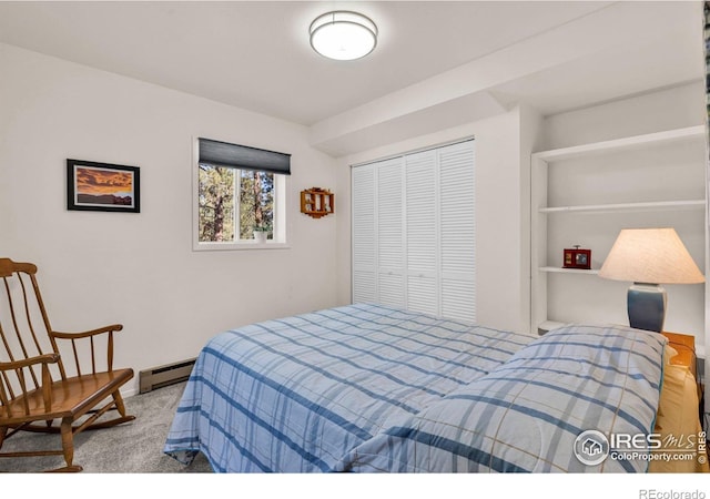 453 Black Fawn Ln, Westcliffe, CO 81252 - bedroom with baseboard heating, a closet, and carpet