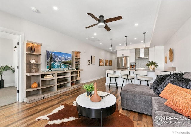 221 E Mountain Ave Unit 319, Fort Collins, CO 80524 - living area with a ceiling fan, hardwood / wood-style flooring, baseboards, and recessed lighting