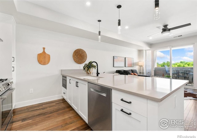 221 E Mountain Ave Unit 319, Fort Collins, CO 80524 - kitchen featuring appliances with stainless steel finishes, a sink, a peninsula, dark wood-style flooring, and recessed lighting