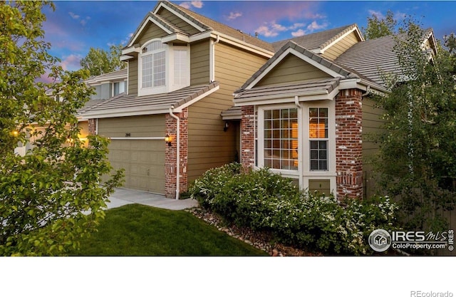2841 Silver Pl, Superior, CO 80027 - view of front of home with brick siding, driveway, and a garage